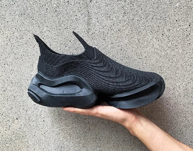 Fully 3D-printed shoes by Zellerfeld showcasing lattice structure and custom-fit design for footwear innovation.